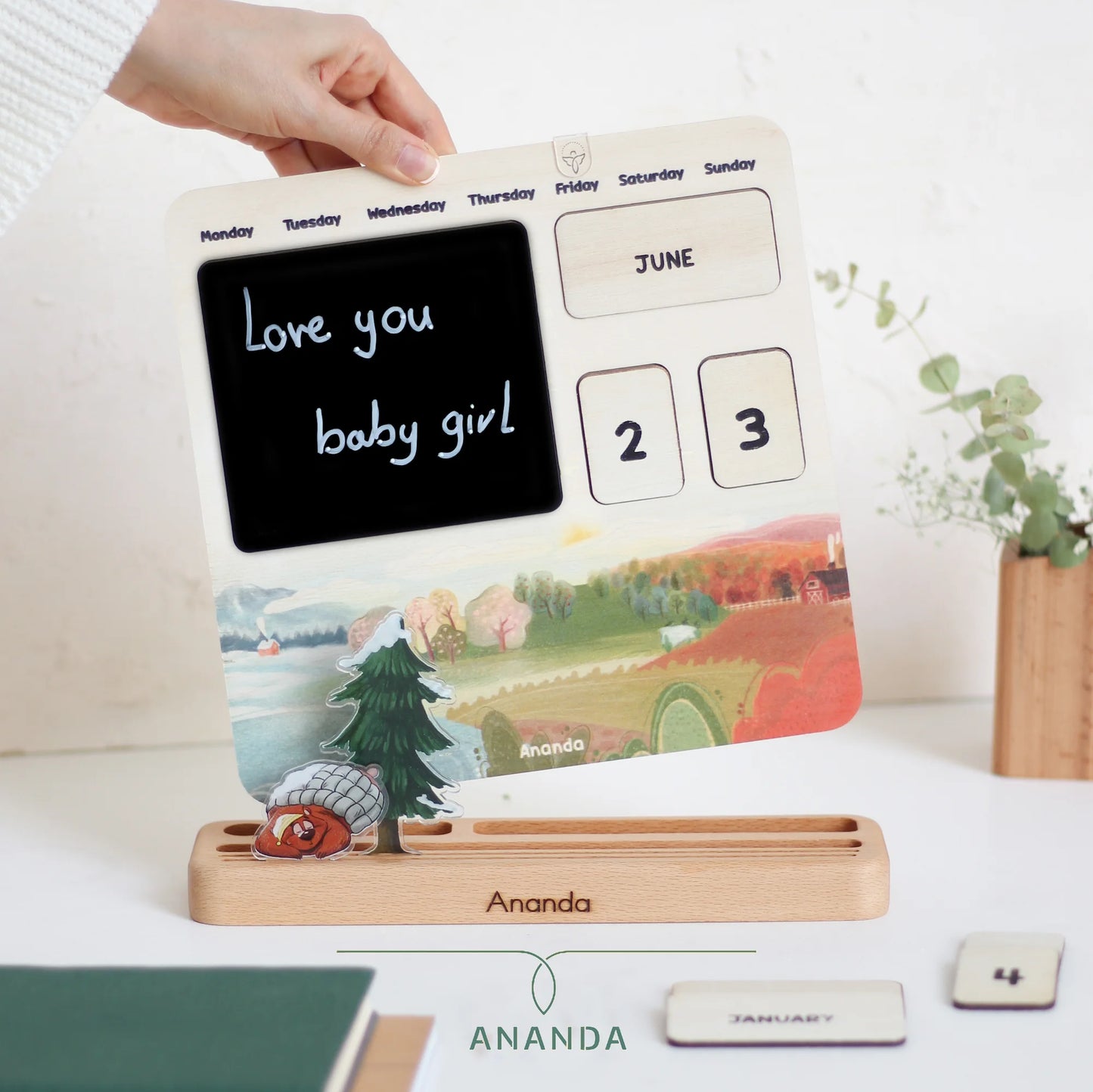 The Hannah perpetual calendar displayed on a beech wood base, with a 3D-style bear character adding a playful touch to the design.