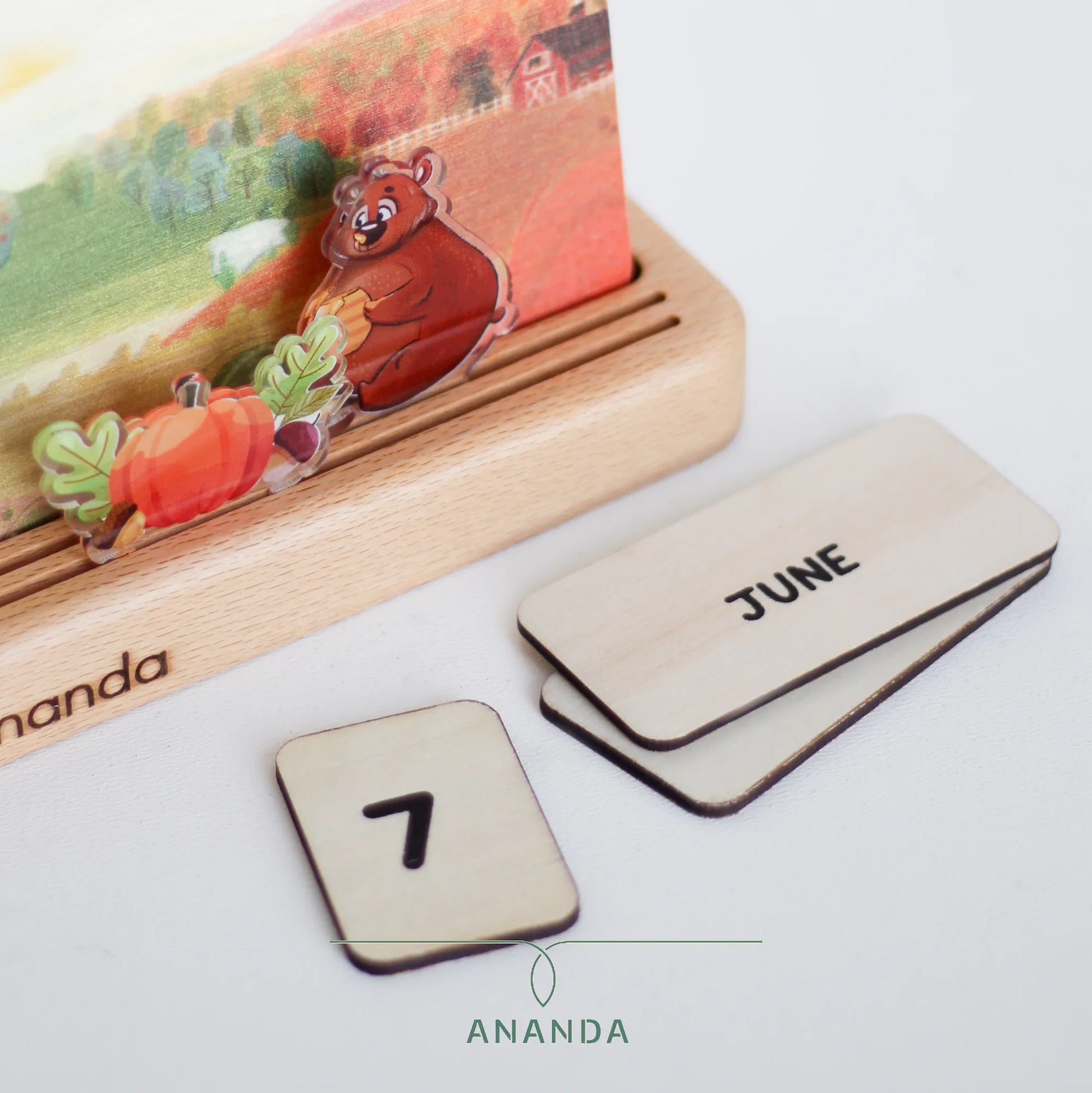 The detailed wooden cutouts of the months and numerical dates, meticulously crafted and displayed on the Hannah calendar. These elements are laser-cut from high-quality wood, ensuring durability and longevity. The craftsmanship is precise, and the pieces are securely attached, offering a tactile and visually appealing way to mark time, with clear visibility and easy customization for each day of the year.