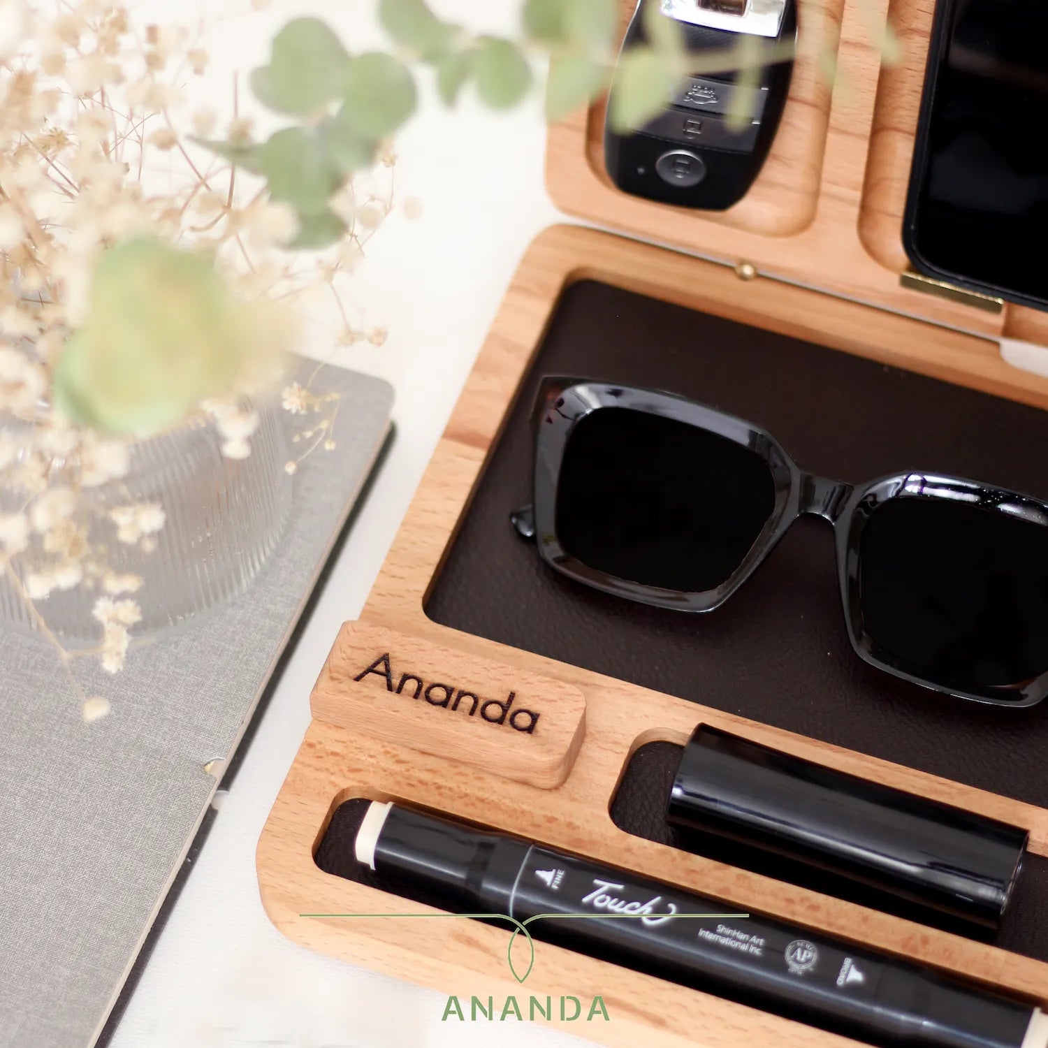  Lifestyle shot of MyOne Big on a work desk with personal accessories inside perfect gift for him or her