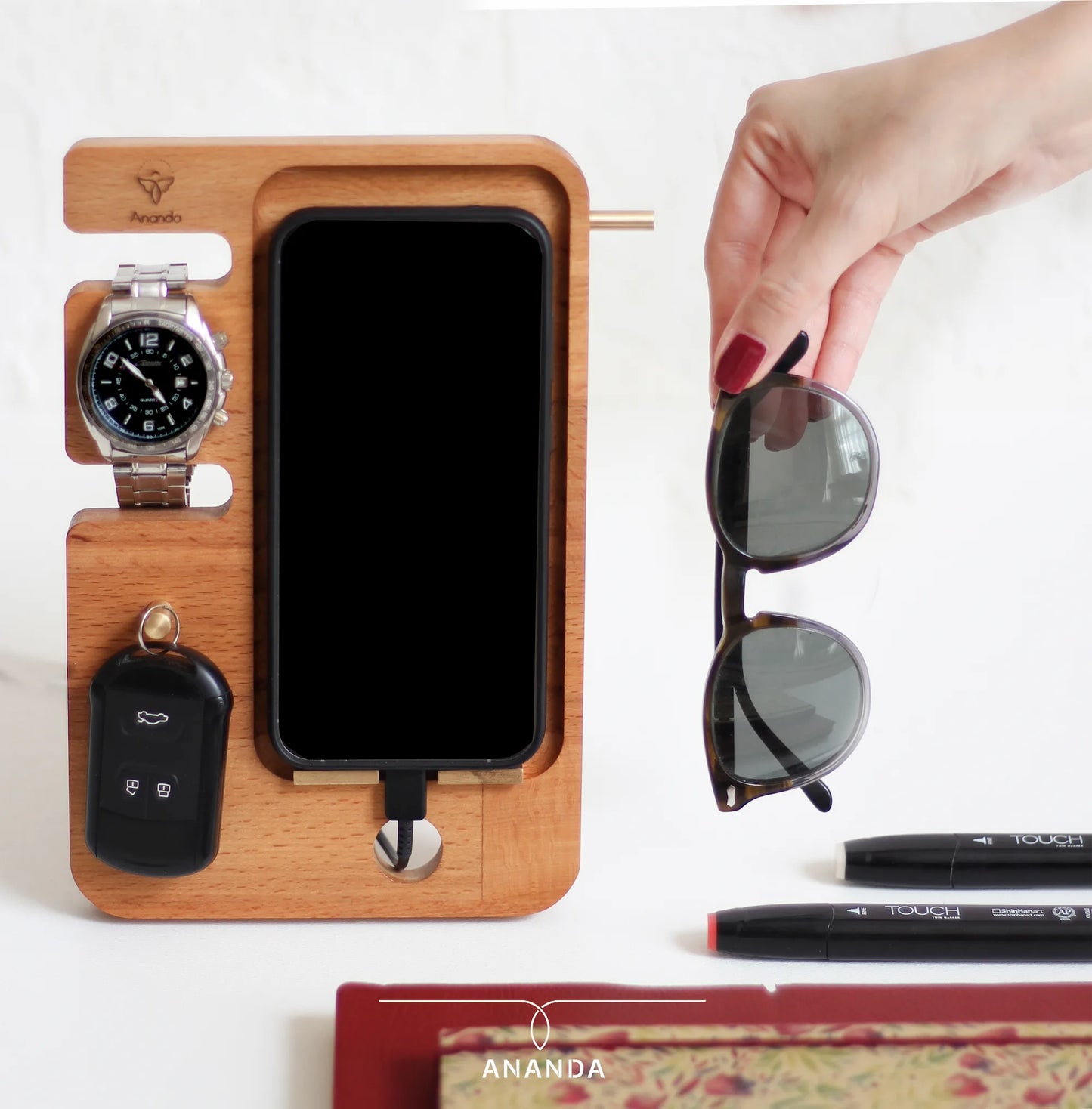 phone and accessories stand Side view showing brass glasses holder bar set in wood