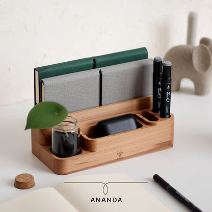 Wooden desk organizer with notebook, pens, and jar planter