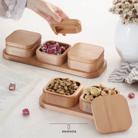  Wooden snack box set with lid, placed on kitchen counter and filled with dried fruits and nuts
