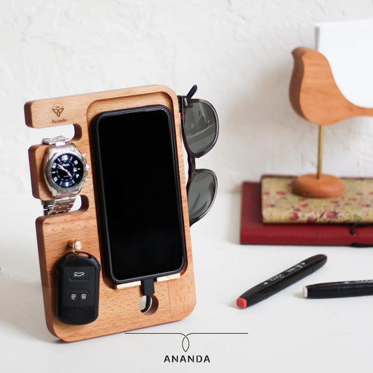 Pro Stand with phone, keys, watch, and glasses organized on desk
